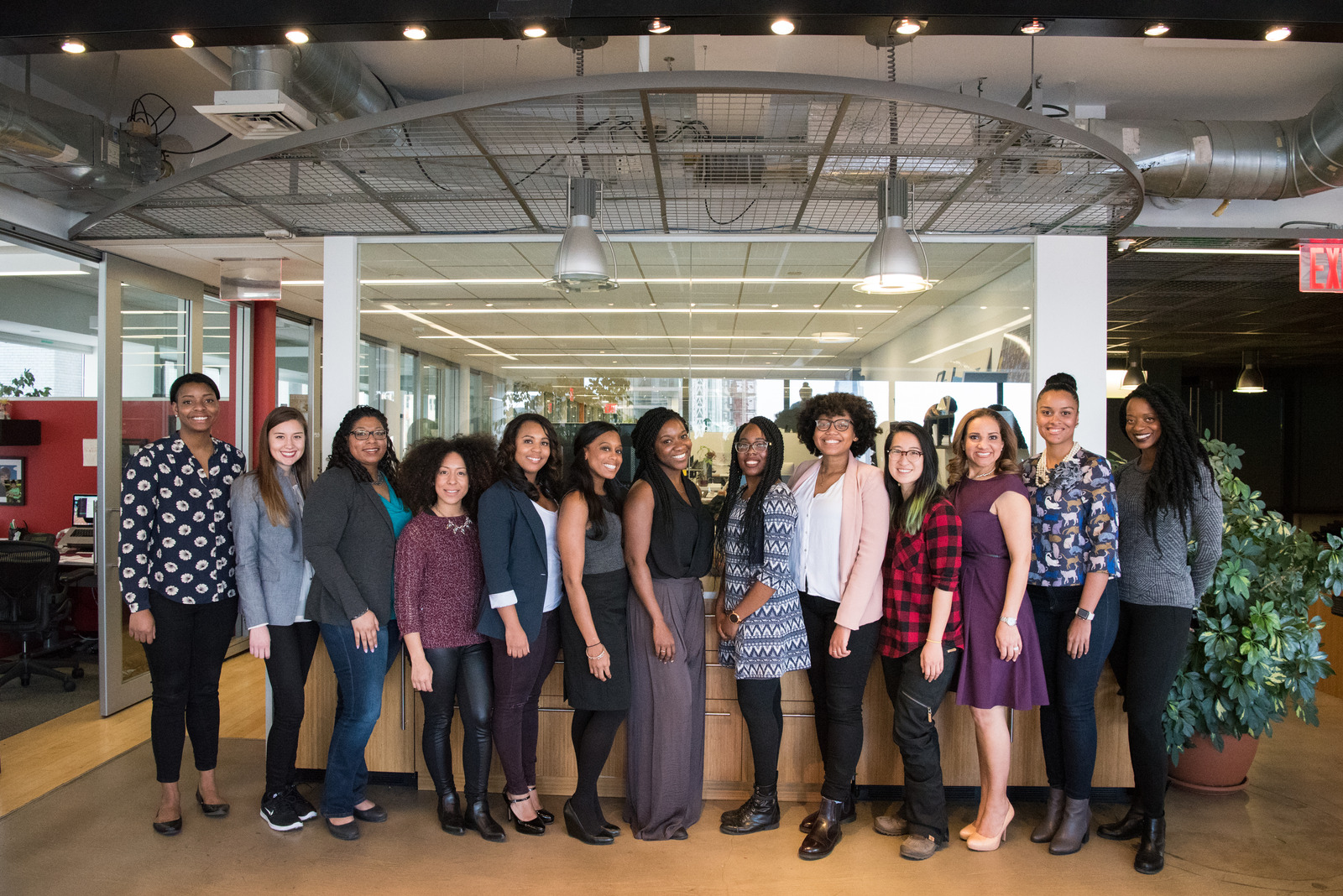 Canva – Group of Women Standing Near Desk